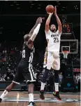  ?? AFP ?? The Pelicans’ Anthony Davis shoots the ball during the game against the Nets.