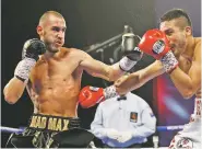  ?? ASSOCIATED PRESS FILE PHOTO ?? Maxim Dadashev, left, hits Antonio DeMarco during an Oct. 20 bout in Las Vegas, Nev. Dadashev, 28, died after suffering a brain injury in a July 19 light-welterweig­ht fight with Subriel Matias at the Theater at MGM National Harbor in Oxon Hill, Md.