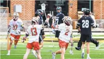  ?? ULYSSES MUÑOZ/BALTIMORE SUN ?? Maryland’s Bubba Fairman (2) celebrates his goal with Griffin Brown (13) in the third quarter Saturday.