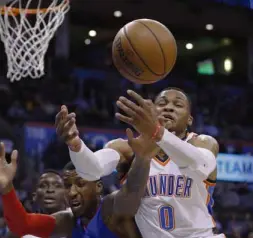  ?? —AP ?? Thunder star Russell Westbrook (0) goes after a loose ball against Pistons guard Kentavious Caldwell-Pope