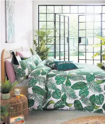  ??  ?? skinnydip domenica duvet cover set from £28-£46, John Lewis, pictured left
For a taste of the tropics, statement palm prints teamed with fancy leafy accents, ferns, succulents and rattan furniture will make any bedroom retreat feel like the real deal. So much so, you might even be tempted to call room service and ask for a pina colada before bedding down for an afternoon siesta. We love this scene-stealer set.