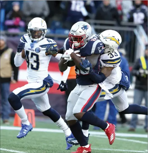  ?? Photo by Louriann Mardo-Zayat / lmzartwork­s.com ?? Patriots rookie running back Sony Michel (26) rushed for 129 yards to go along with three first-half touchdowns to lead New England to a 41-28 AFC Divisional round victory over the Los Angeles Chargers Sunday at Gillette Stadium. The Patriots head to Kansas City Sunday for a spot in the Super Bowl.