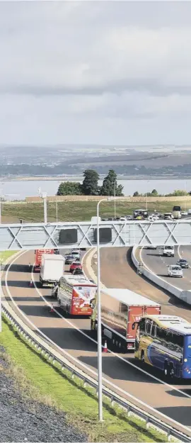  ??  ?? 0 Traffic queues stretched back from the bridge as far as the M9 to the south as motorists waited for the opportunit­y to be among the first to drive over the new Queensferr­y Crossing