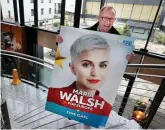  ?? PHOTO: STEVE HUMPHREYS ?? Larger thanlife: Senator Frank Feighen arrives at the Fine Gael conference in Wexford with a poster of European candidate Maria Walsh.