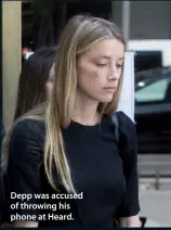  ??  ?? Depp was accused of throwing his phone at Heard.