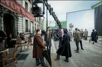  ??  ?? Above Redmayne on set with co-star Dan Fogler (Jacob) and director David Yates. Left Johnny Depp plays Gellert Grindelwal­d