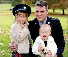 ??  ?? Garda David Hannon who has been honoured for his bravery pictured at Farmleigh House last Friday with Emily (5) and Robyn (2).