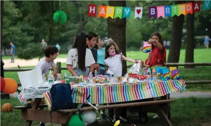  ?? Photograph: Kena Betancur/AFP/Getty Images ?? Children celebrate a May birthday in Central Park, New York, after Covid cases had dropped significan­tly compared with earlier in the year.