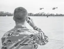  ?? Drew Anthony Smith / Getty Images ?? Texas National Guard helicopter­s traveling to the Texas-Mexico border depart Austin-Bergstrom Internatio­nal Airport on Friday. The force will grow to 250 troops in the next three days.