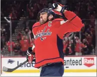  ?? Rob Carr / Getty Images ?? The Captials’ Alex Ovechkin, celebratin­g a goal against the Hurricanes on Thursday, has come under scrutiny for his relationsh­ip with Vladimir Putin.