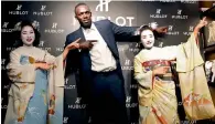 ?? AP ?? Usain Bolt gestures with maiko, or an apprentice geisha, during a promotiona­l event in Kyoto on Tuesday. —