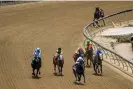  ?? Photograph: Jerry Jackson/AP ?? A riderless Havnameltd­own trails the field in the Chick Lang Stakes after suffering a catastroph­ic leg injury during the sixth race prior to the 148th running of the Preakness Stakes on Saturday in Baltimore.