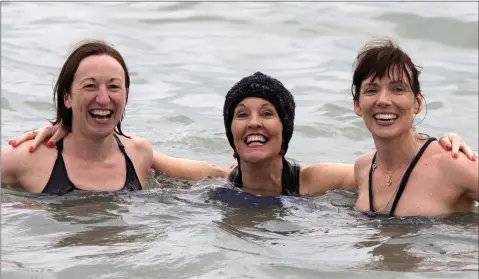  ??  ?? Catherine Stanley, Aoife Kavanagh and Bronagh Daly taking the plunge at the Christmas Day Swim in Greystones.