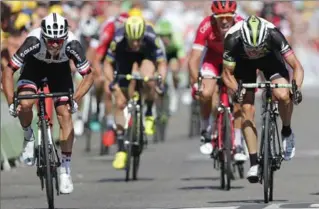  ?? CHRISTOPHE ENA, THE ASSOCIATED PRESS ?? Australia’s Michael Matthews, left, sprints to win Stage 16 of the Tour de France on Tuesday.