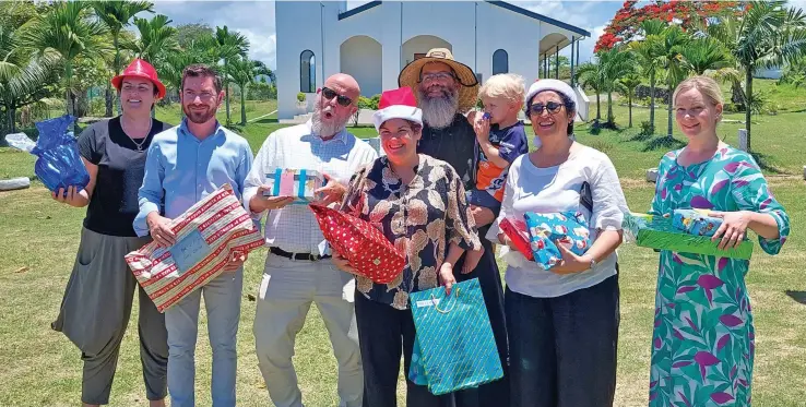  ?? Photo: Nicolette Chambers ?? (From Left) Aspen Medical Fiji executive assistant, Nicole Herberts, project manager - capital works, Martin Lane, chief operations officer, Barry Herberts, CEO, Annette Owttrim, St Tabitha Orphanage Fiji home manager, Father Andronikos Erasmus holding his son, Theodore, Lautoka Hospital medical superinten­dent Dr Rigamoto Taito and Presu Yulitta Erasmus at Saweni, Lautoka
on December 21, 2022.