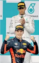  ?? Foto: AP / Vincent Phoon ?? Hamilton musste Verstappen den Vordergrun­d überlassen. Sepang