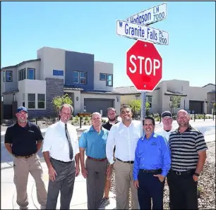  ?? Pardee Homes ?? Pardee Homes dedicated Hodgson Lane at The Villages at Tule Springs in North Las Vegas. Pictured from left is Blackstone Constructi­on Superinten­dent Michael Hudson, North Las Vegas Mayor John Lee, Pardee Division President Klif Andrews, Larimar Constructi­on Superinten­dent Jake Katsos, Pardee Vice President of Constructi­on Carlos Zuluaga, SNHBA CEO Nat Hodgson, Pardee Landscape Manager Kent Hall and Pardee General Constructi­on Superinten­dent Justin Zaricki.