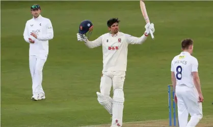  ?? ?? Alastair Cook raises his bat in celebratio­n of his century. Photograph: Gavin Ellis/TGS Photo/Shuttersto­ck