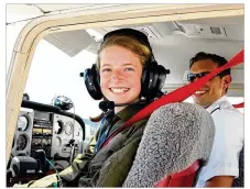  ?? CONTRIBUTE­D ?? At the controls of a Cessna 172, an Air Camp student preparesfo­r her first flight with an instructor.