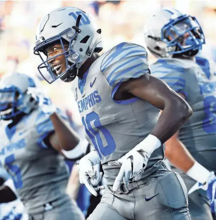  ??  ?? Memphis receiver Damonte Coxie celebrates a touchdown against Georgia State during the Tigers’ 59-22 win on Friday. MARK WEBER / THE COMMERCIAL APPEAL