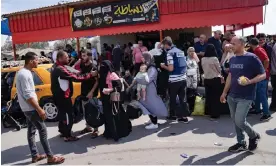  ?? Photograph: Fatima Shbair/AP ?? Palestinia­ns wait to cross into Egypt at the Rafah border crossing in the Gaza Strip, 16 October 2023.