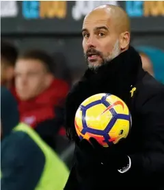  ??  ?? ON THE BALL: Manchester City manager Pep Guardiola reacts during his pace-setting team’s Premier League match against Swansea City at the Liberty Stadium on Wednesday night. City won 4-0.