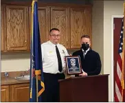  ?? COURTESY OF PENNRIDGE REGIONAL POLICE ?? Pennridge Regional Police Chief Rodney Blake, left, presents a plaque to retiring Officer Stephen DiGiovanni.