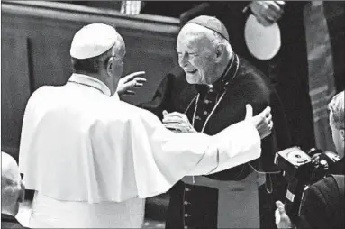  ?? JONATHAN NEWTON/THE WASHINGTON POST ?? Pope Francis, left, is seen in 2015 with Cardinal Theodore McCarrick, who faces allegation­s he sexually abused boys and adults. Francis ordered him suspended “from the ... ministry.”