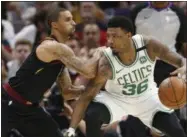  ?? THE ASSOCIATED PRESS FILE ?? The Cavaliers’ George Hill defends the Celtics’ Marcus Smart. The Cavs will be depending on Hill’s defense against Warriors guard Steph Curry.