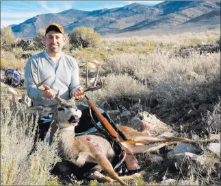  ?? Doug Nielsen ?? Paul Mona of Henderson harvested this buck in central Nevada. The state offers excellent hunting opportunit­ies for mule deer and other big game species, but tags are limited.