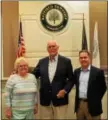  ?? SUBMITTED PHOTO — COURTESY OF HATFIELD TOWNSHIP ?? Longtime Hatfield Township Municipal Authority volunteer Charles Sibel, center, is recognized by Hatfield commission­ers’ President Tom Zipfel, at right, for 45 years of service on the authority’s board of directors May 24. At left is Sibel’s wife, Mary...