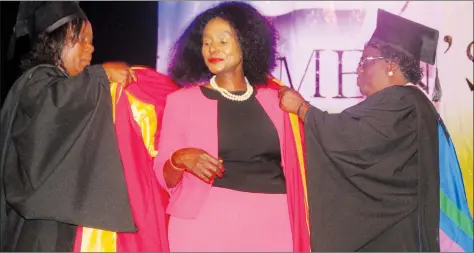  ??  ?? Nicoz Diamond managing director Mrs Grace Muradzikwa is conferred with an honorary doctorate at Women’s University in Africa’s graduation ceremony yesterday