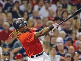  ?? ELISE AMENDOLA/The Associated Press ?? Boston Red Sox designated hitter Hanley Ramirez hits a two-run home run against the Los Angeles Angels during the fourth inning of a baseball game at Fenway Park, Friday in Boston.