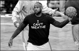  ?? FRANK FRANKLIN II / ASSOCIATED PRESS FILE (2014) ?? Lebron James wears a T-shirt protesting the death of Eric Garner, before a game Dec. 8, 2014.