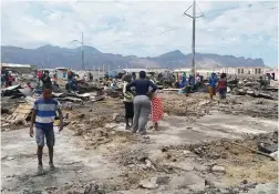  ?? PICTURE: VELANI LUDIDI ?? DEVASTATIO­N: 500 people have been left homeless at Chris Hani Park informal settlement at Nomzamo, Strand.