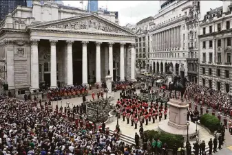  ?? Leon Neal / Associated Press ?? Members of the Honourable Artillery Company, the oldest regiment in the British Army, wait at the Royal Exchange for a Proclamati­on of Accession of King Charles III in the City of London.