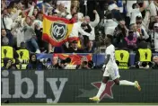  ?? MANU FERNANDEZ — THE ASSOCIATED PRESS ?? Real Madrid’s Vinicius Junior celebrates after scoring the opening goal during the Champions League final against Liverpool at the Stade de France in Saint Denis, near Paris.