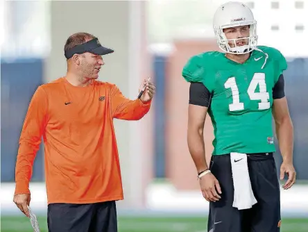  ?? [PHOTO BY BRYAN TERRY, THE OKLAHOMAN] ?? Oklahoma State offensive coordinato­r Mike Yurcich has been reported as a candidate for Tennessee’s vacant offensive coordinato­r position.