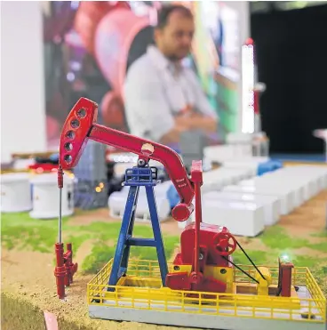  ?? Picture: EPA ?? TROUBLED WATERS: A model of an oil well at the stand of the China National Petroleum Corporatio­n at the World Petroleum Congress in Moscow. Global investors are worried by plummeting oil prices, which have fallen by about 50% since last year as a...