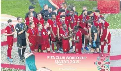  ?? AFP ?? Liverpool players celebrate winning the Fifa Club World Cup final in Doha.