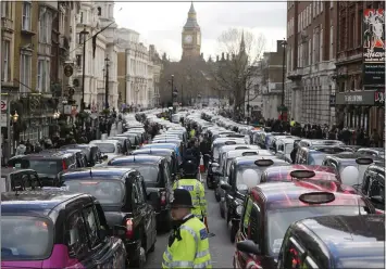  ?? ASSOCIATED PRESS ARCHIVES ?? London taxis block the roads during a 2016protes­t in central London over concerns about unfair competitio­n from services such as Uber. The London transit operator says it has decided not to renew Uber’s license in the British capital.