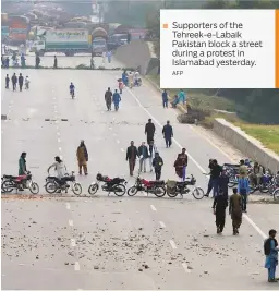  ?? AFP ?? Supporters of the Tehreek-e-Labaik Pakistan block a street during a protest in Islamabad yesterday.