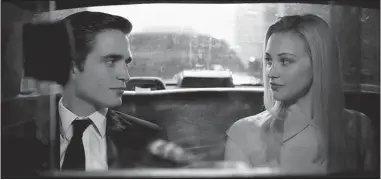  ??  ?? Robert Pattinson, with Sarah Gadon, plays a Manhattan billionair­e in Cosmopolis.