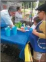  ??  ?? Polly Held, MCHS office assistant, leads a kid planting station activity in 2017. Several kids’ activities are planned for the Cottage Lawn Farmers Market at the Madison County Historical Society on Tuesdays from 3-7p.m.