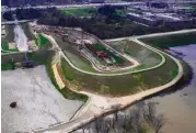  ?? Mark Mulligan / Houston Chronicle ?? Water flows out of the Addicks reservoir down the main spillway Tuesday.