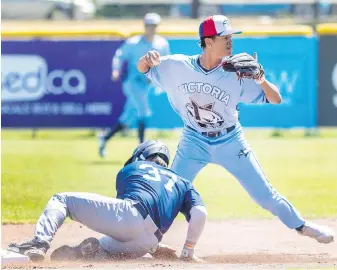  ?? DARREN STONE, TIMES COLONIST ?? HarbourCat­s infielder Tyrus Hall forces out Sweets baserunner Logan Meyer at second base while completing a double play to firsts during WCL action at Wilson’s Group Stadium at Royal Athletic Park on Wednesday afternoon.