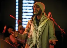  ?? Ibrahim Kabakibi ?? From top, more than two dozen performers, including artists, musicians and poets, took part in the Artists for Peace – Shadow Ban This! event in Dubai; Mohammad ElChawa produced a mural; and singer Amjad Shakir also performed