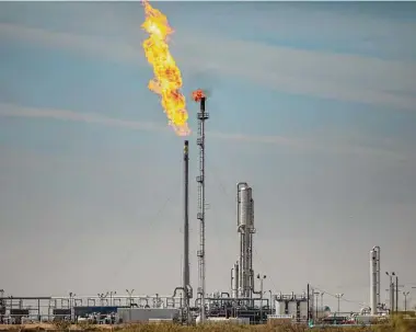  ?? Jonah M. Kessel/New York Times ?? Gas is flared at the Targa Driver Gas Plant Nov. 5, 2019, in the Permian Basin. The state is now investigat­ing why the operator failed to report a Jan. 20 incident on time.