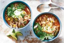  ?? FOOD STYLIST: LIZA JERNOW. JULIA GARTLAND/THE NEW YORK TIMES ?? Bowls of Sarah DiGregorio’s slow cooker white chicken chili, which can be served solo or over rice with sour cream and shredded cheddar on the side, in New York.