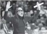  ?? SEAN RAYFORD/AP ?? South Carolina coach Dawn Staley gestures to players during the first half of a game against Clemson on Wednesday in Columbia, S.C.